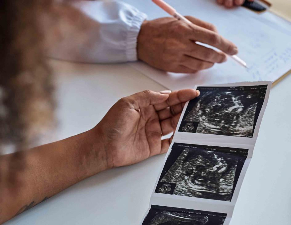 woman looking at sonogram