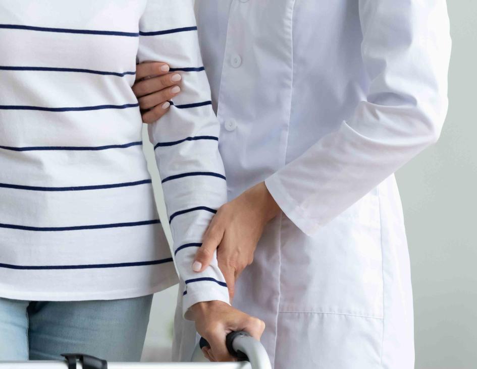 doctor helping patient rehab walking