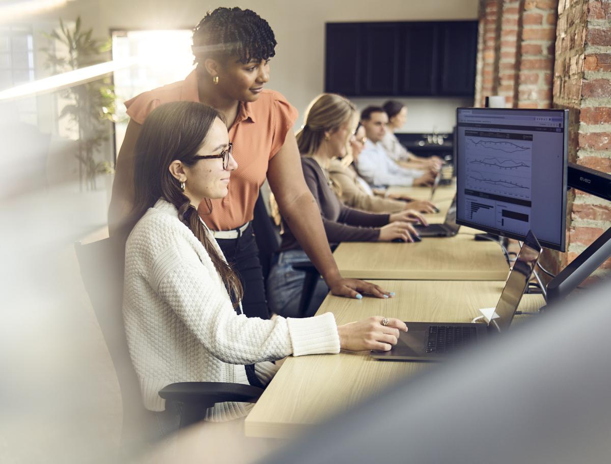 two Fathomers collaborating on digital marketing