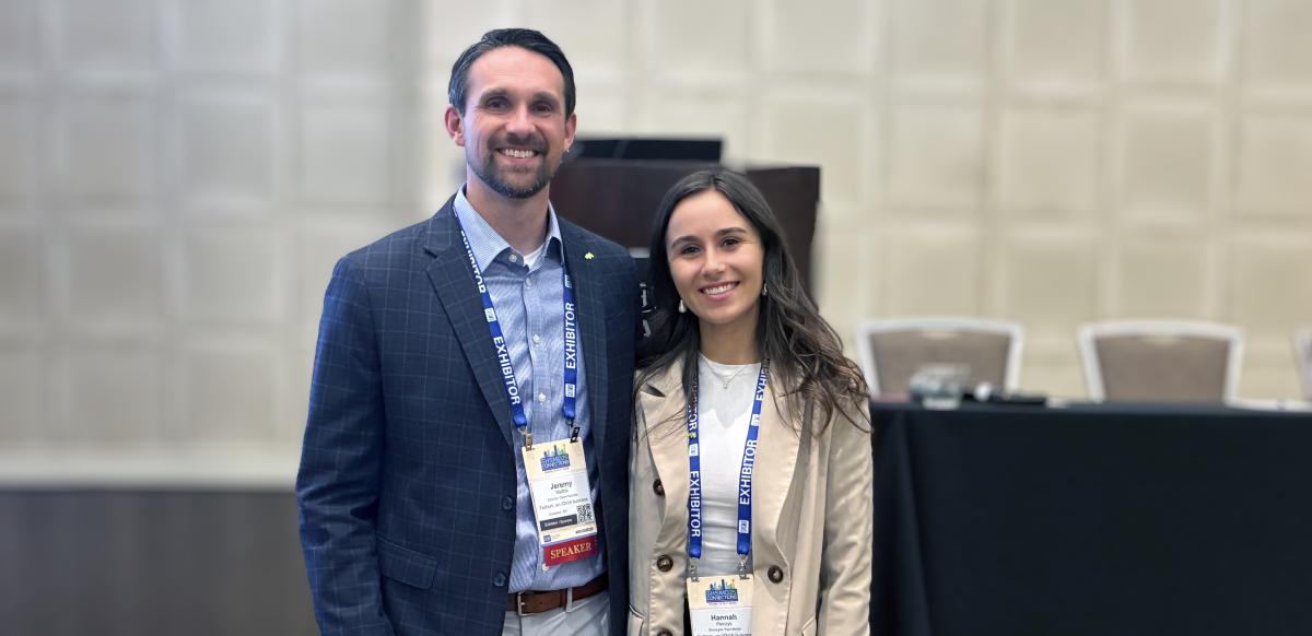 Jeremy Mathis and Hannah Patrzyk smiling before their presentation