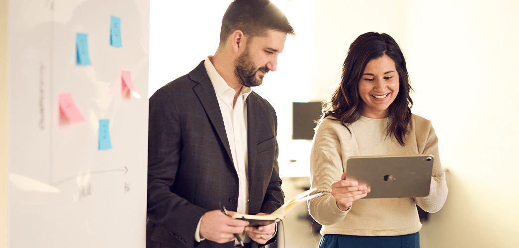 Joe Loar and Leslie Becker reviewing results on an iPad