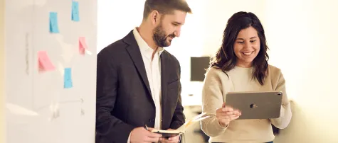 Joe Loar and Leslie Becker reviewing results on an iPad
