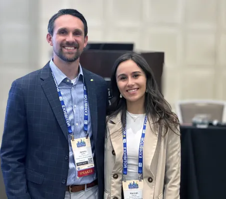 Jeremy Mathis and Hannah Patrzyk smiling before their presentation
