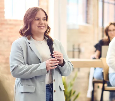 Elise presenting to an audience