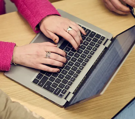 A Fathom Marketer on a laptop