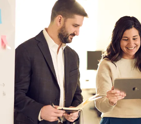 Joe Loar and Leslie Becker reviewing results on an iPad